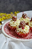 April Fool's cupcakes with fake meatballs, pasta, tomato sauce and Parmesan cheese