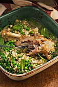 Leg of lamb with barley, peas and mint