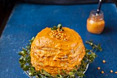 A pancakes cake with pumpkin and sea buckthorn