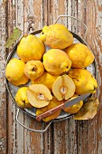 Quinces on a rustic wooden table
