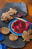Pumpkin seed and flaxseed crackers with beetroot hummus