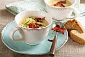 Potato and cheese soup with ham chips