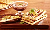 Brussels waffles with fried bananas and chocolate and rum sauce