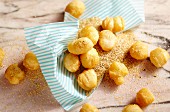 Deep-fried puff pastry balls with tonka bean vanilla sugar