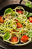 Courgette noodles with sautéed cherry tomatoes and basil