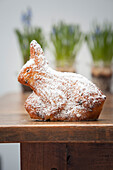 A baked Easter bunny dusted with icing sugar