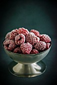 Frozen raspberries in an ice cream bowl