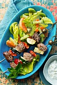 Lamb kebabs with vegetables and sesames seeds