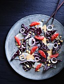 Ceviche with red cabbage, peanuts and grapefruit