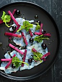 Pickled kohlrabi with black olives and fish carpaccio