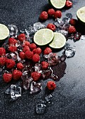 Raspberries, limes and ice cubes
