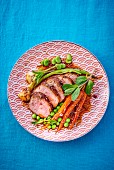 Lamb fillet with carrots and peas