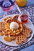 Heart-shaped waffles with vanilla ice cream and apples