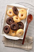 Glazed doughnuts and chocolate-coated doughnuts