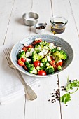 Broccoli salad with cherry tomatoes and mozzarella