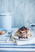 A stack of pancakes with blueberries