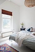 Bright bedroom with white walls