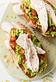 Toast with avocado and chicken (seen from above)