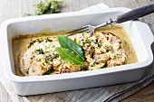 Gratinated turkey escalope with courgette, feta cheese and herbs