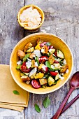 Bread salad with cherry tomatoes and Parmesan cheese