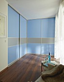 DIY wardrobes with floor-to-ceiling, blue sliding doors