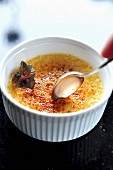 Crème brûlée with spoon
