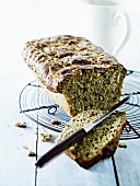 Homemade bread on a cooling rack, sliced