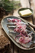 Pickled herring with onions and mustard seeds