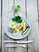 Tuna fish mousse with herbs served with soft boiled eggs and julienned vegetables