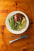 Black Angus meatloaf with brown sugar, tomato sauce, garlic mashed potatoes and green beans