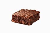 A fudgy brownie on a white surface