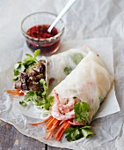 Rice paper rolls filled with glass noodles, prawns, beef, carrot strips, mint and coriander (Vietnam)