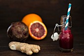 A bottle of beetroot smoothie with ginger, blood oranges and beetroot