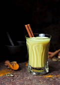 Golden milk: milk drink with turmeric, cardamom and cinnamon