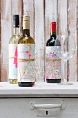 Wine bottles wrapped in maps as gifts