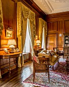 Grand interior with panelled walls and heavy curtains