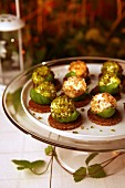 Goats' cheese balls with basil, pistachios and nuts