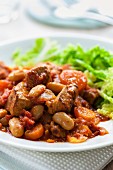 Pork ragout with beans and tomatoes