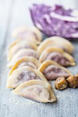 Homemade ravioli with red cabbage and chestnuts