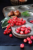 Cranberries, redcurrants and chestnuts in an old baking tin