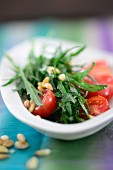 Rocket salad with tomatoes and pine nuts