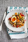 Fregola and tomato salad with egg