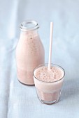 A banana and cherry smoothie made with soya milk