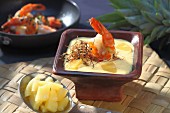 Pineapple and curry soup with prawns