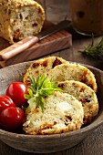 Herb bread with tomatoes and feta cheese baked in a glass