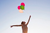 A woman with balloons