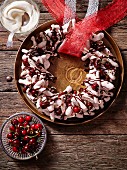 Chocolate meringue wreath with cherries