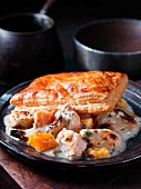Chicken ragout with pumpkin and puff pastries