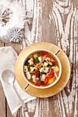 Fish soup with carp, tomatoes and potatoes for Christmas