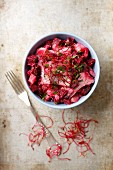 Herring with beetroot, potatoes, cream and beetroot sprouts